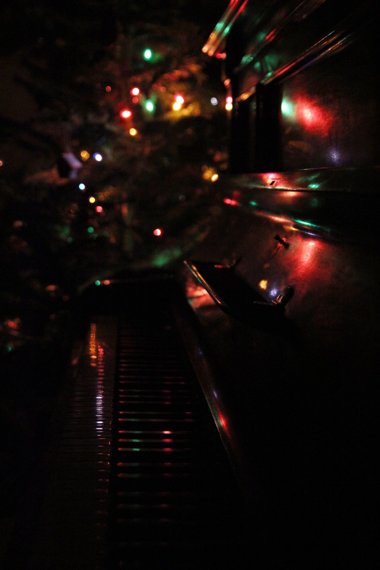 Piano And Christmas Tree In Dark